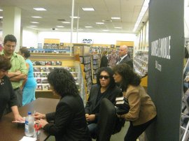 Lyn greets Gene at the KISS Nothin' to Lose book signing in Staten Island, NY. 